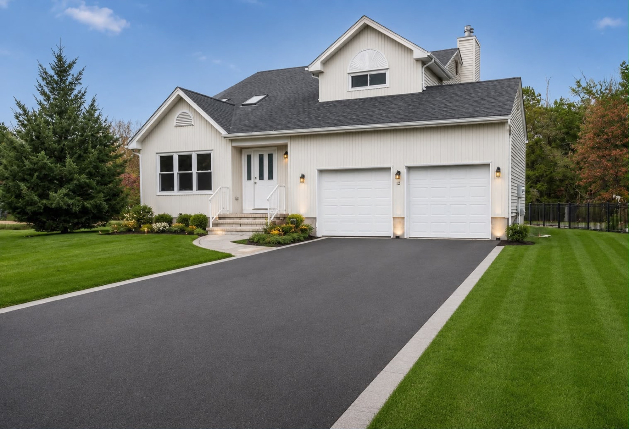 Prilux Villa — front exterior with manicured lawn and double garage